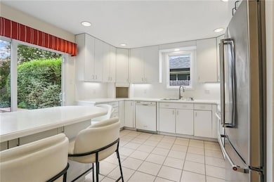 Thoughtfully designed bright kitchen with the oval