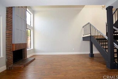 Another view of fireplace and living area