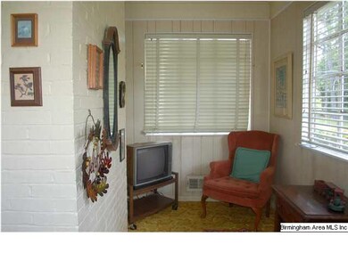 Quaint sunroom in front of house as you enter.