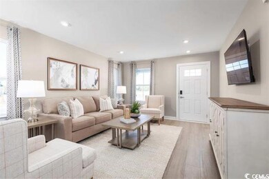 Living room featuring light hardwood / wood-style 