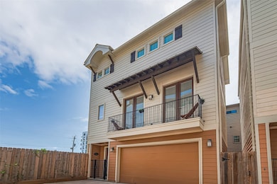 This modern three-story home features a two-car ga