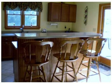 Kitchen. Breakfast bar looking out over kitchen, b