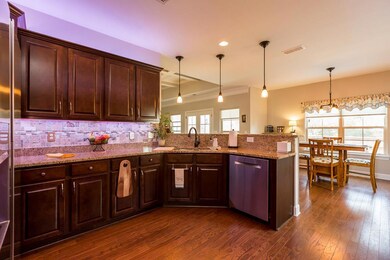 The kitchen has a new backsplash and under-cabinet lighting throughout. 