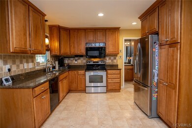 Kitchen, tile backsplash, pull out shelves and sof