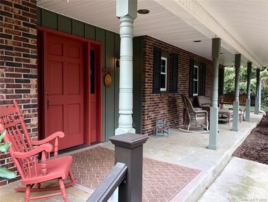 The front porch has many seating option included a two person swing!