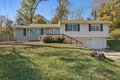 Charming split-level home with a brick exterior an