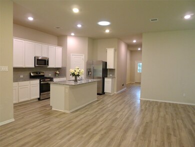 Ample foyer leads you to this open/bright fabulous home with gorgeous wood-look vinyl plank floor. Look at this unique Sunlight lamp to bright the kitchen and gigantic den.