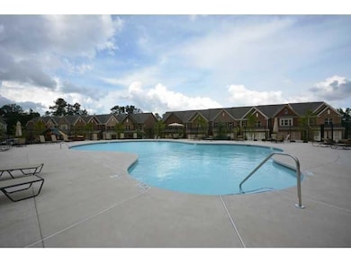 Community pool with a residential view and a patio