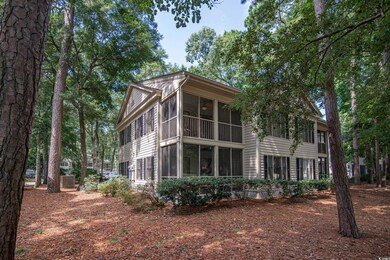 Back of house with a sunroom
