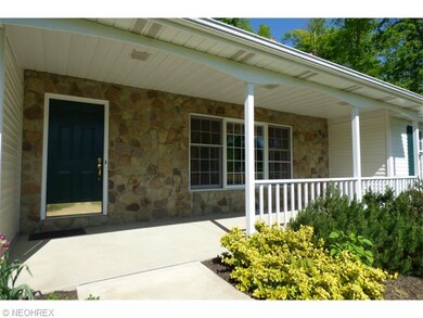 Beautiful covered porch entry with real stone!  A 