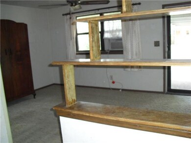 Living Room. from kitchen towards front door