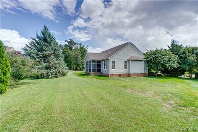Rear view of beautifully maintained home on large