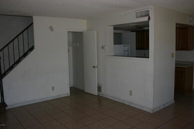 Living Room leading to Stairs & Storage