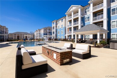 View of patio featuring a community pool, an outdo