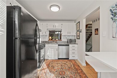 The kitchen offers updated appliances.