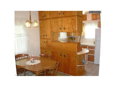 Carpeted Dinette with ceramic tile kitchen combo. 