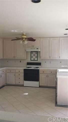 Clean and very spacious kitchen with ceramic tiles