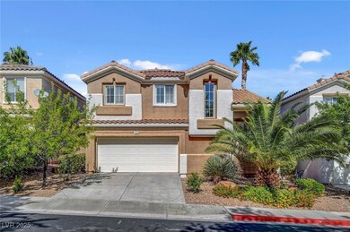 Mediterranean / spanish home with a tile roof, driveway, stucco siding, and an attached garage