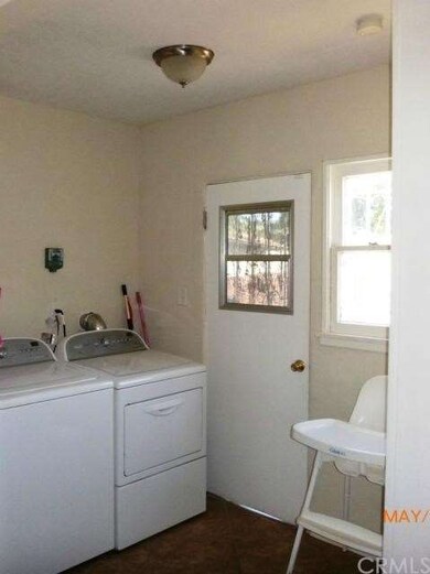  Laundry inside rear door in separated area