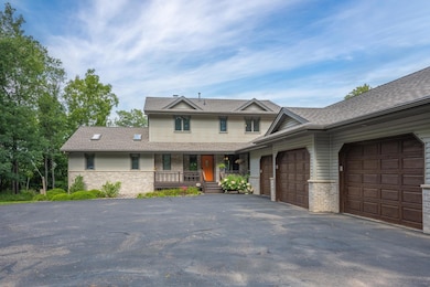 Paved driveway leads you to the three car garage