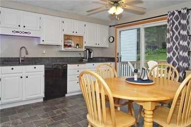 Spacious eat in white kitchen with lots of cabinet