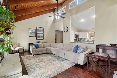 Living room featuring wooden ceiling, high vaulted