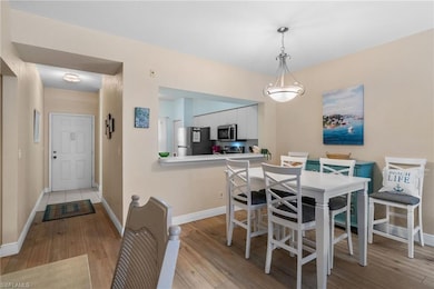 Dining area featuring baseboards and light wood-st
