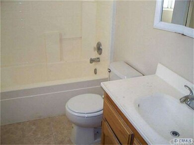 Bathroom 1 with new flooring, toilet and fixtures.