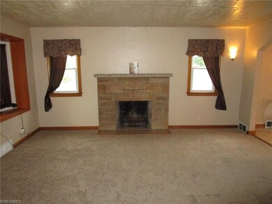 Living Room with Woodburning Fireplace