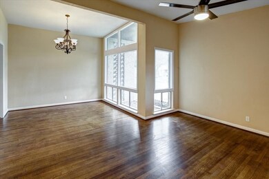 Notice the elegant floor to ceiling windows in the dining rooms and curved round into the formal living area.  The bottom windows open.