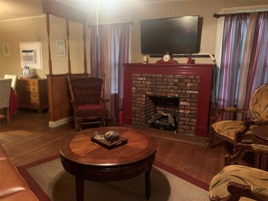 Living room featuring hardwood / wood-style floori