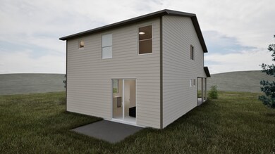 Rear view of house with a lawn and a patio area