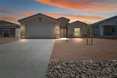 Ranch-style house featuring stone siding, concrete