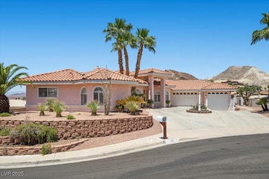 Mediterranean / spanish house with an attached gar