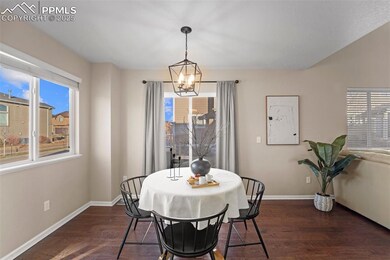 Lovely dining room with new light fixture and walk