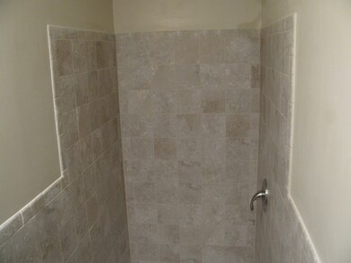 Another view of master bath with tile.