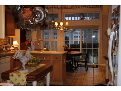 Large Eat In Kitchen with slider to covered patio.