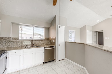 Large Granite Breakfast Bar, Large window for natural lighting. Stainless Appliances, Double Sink