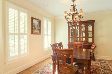 Teaming with bright indirect light, this dining room possesses gracious appointments and endless entertainment possibilities – with adjoining butler pantry, too.