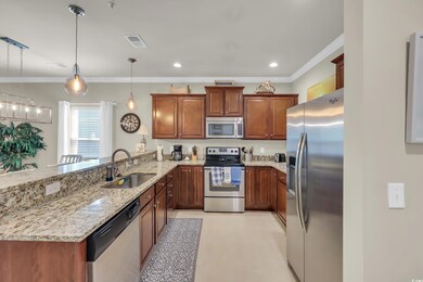 Kitchen with appliances with stainless steel finishes, a peninsula, crown molding, light stone countertops, and brown cabinets