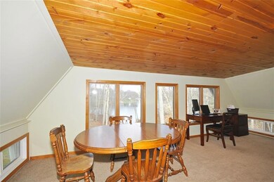 Fantastic Sunroom is a great dining and office space with amazing views of the lake!