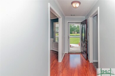 Nice foyer entry with coat closet and storm door.