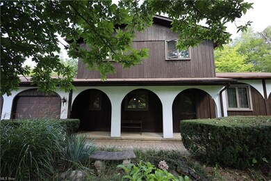 View of front facade featuring garage