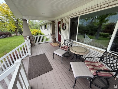 Porch featuring a yard
