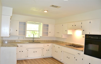 Open kitchen leads to the living/dining room makin