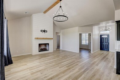 Unfurnished living room featuring high vaulted cei