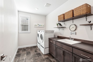 Large laundry room with shelving and 76