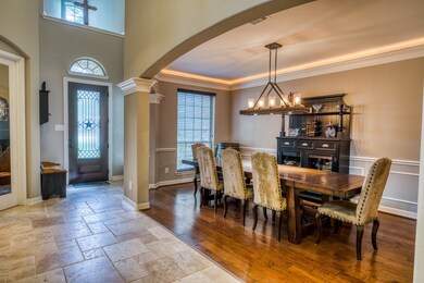 Formal Dining overlooking the travertine entryway.