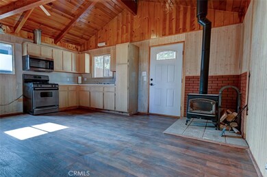 The front cabin has new waterproof vinyl flooring, new front door,it's own wood burning stove and famous wood accenting from the Peterson craftman and builder. Wait till you see the wood ladder made for wonderful memories.