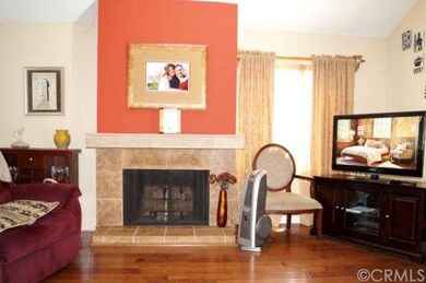 A warm fireplace in the spacious living room.